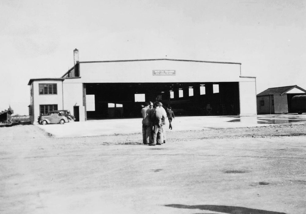 males standing in front of RCAF 11 (CAC) Sqn Lysander Hangar on Sea Island on May 25, 1940.