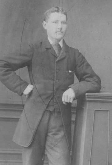 pioneer Thomas Laing standing in a suit